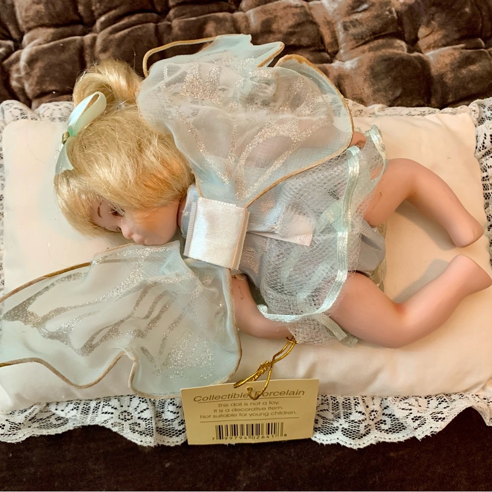 Porcelain Angel Doll with Wings. Moveable arms & legs. Cute little blue dress.